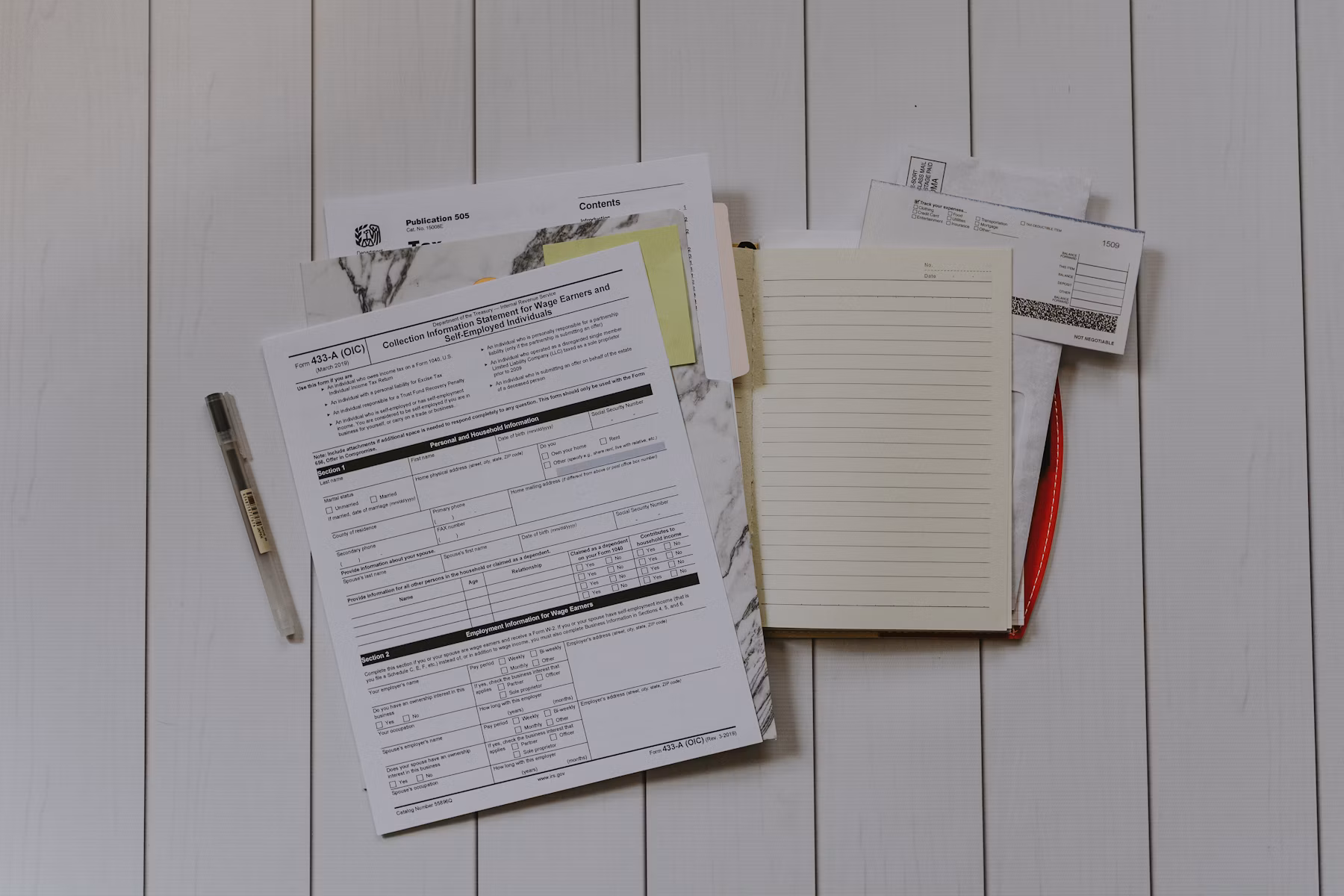 Financial planning documents, charts, and calculator on a desk