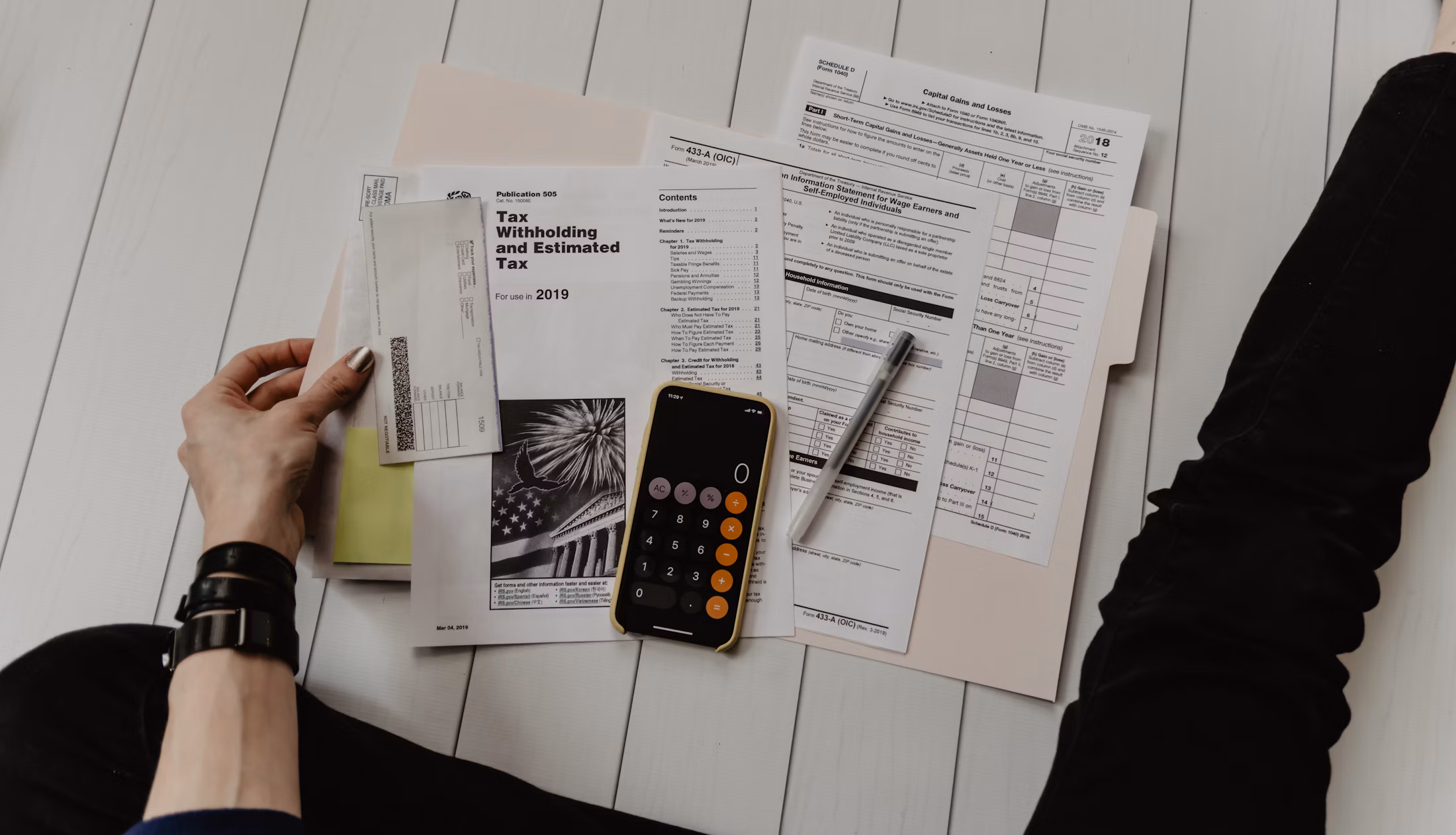 Financial planning worksheet and calculator on a desk