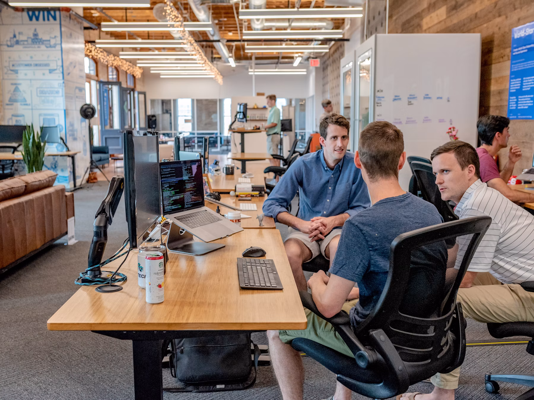 Advisor meeting with clients in a calm office setting